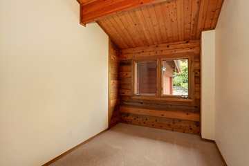 Empty room interior with wooden panel trim walls and  carpet floor