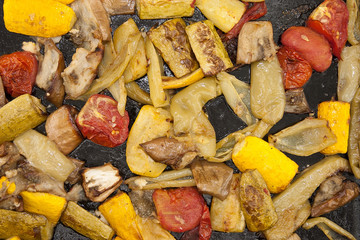 Roasted vegetables on a baking tray. Vegan food. Top view
