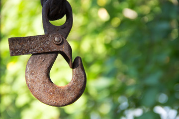 Iron rusty hook on beautiful bokeh background.