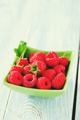 raspberries on wooden surface