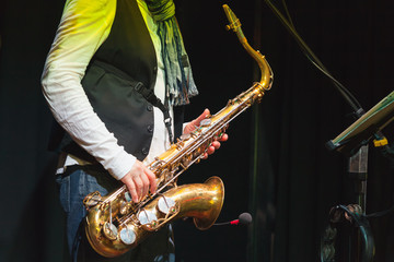 Fototapeta na wymiar Saxophonist on a stage