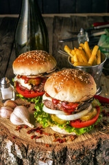 Burgers on rustic table