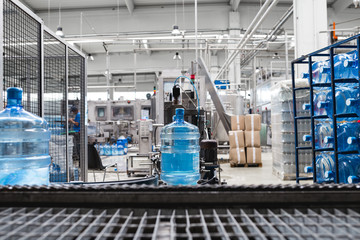 Robotic factory line for processing and bottling pure spring water into used gallons. Short depth...