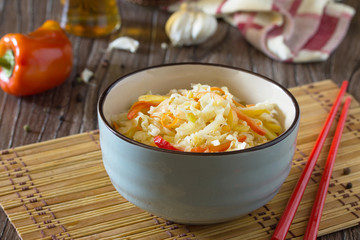 Korean salad of cabbage, carrots, sweet peppers - kimchi in an A