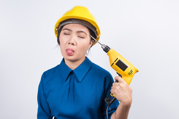 Young builder woman with a drill