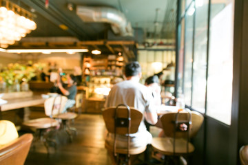 People in Coffee shop blurred background with bokeh light