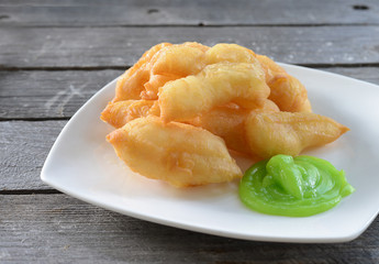 deep-fried dough stick (Patongko) with Pandan custard.