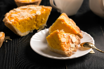 Pumpkin pie with almond slices