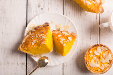Pumpkin pie with almond slices