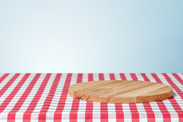 Wooden board with a napkin on a table