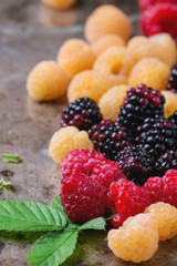 Heap of colorful raspberries 