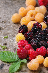 Heap of colorful raspberries 