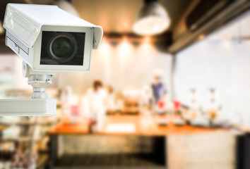 cctv camera or security camera on retail shop blurred background