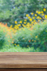 Empty wooden table over cement wall  background