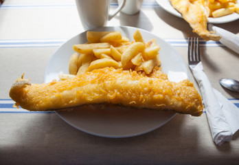 Plate of traditional British fish and chips.