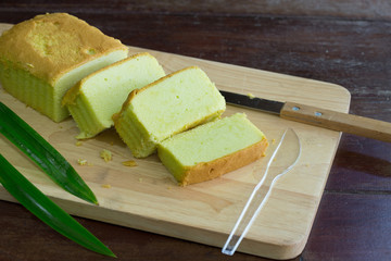 Pandan cake on wooden chopping board / Select focus