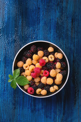 Heap of colorful raspberries 