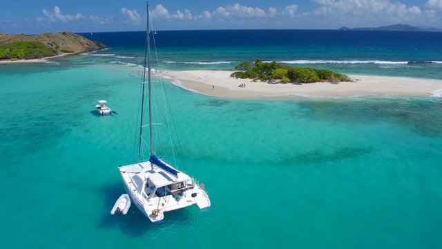 aerial of view of catamaran anchored at Sandy Spit, British Virgin Islands