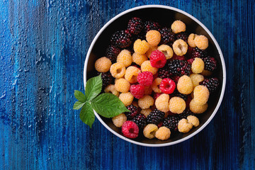Heap of colorful raspberries 