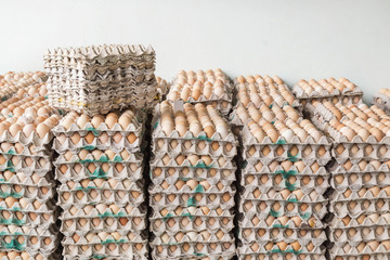 Stacked of eggs in paper trays package 