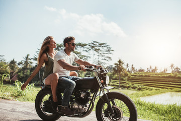 Obraz na płótnie Canvas Young couple on motorbike