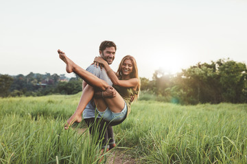 Young loving couple having fun outdoor in summertime