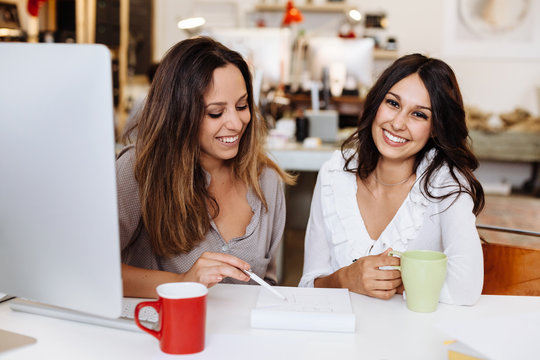 Young beautiful women in the office while working at startup