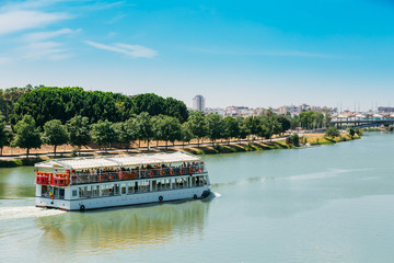 Cruise Ship Floating In Guadalquivir River In Seville, Spain