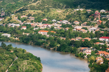 Scenic Top View Of Mtskheta Georgia. Residential Area Along Bank