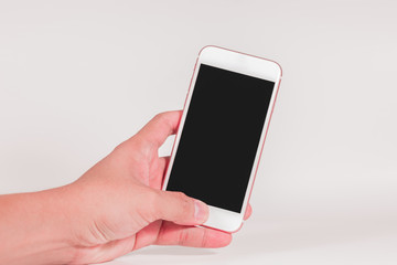 Left hand holding  blank screen smartphone as telecommunication and technology concept