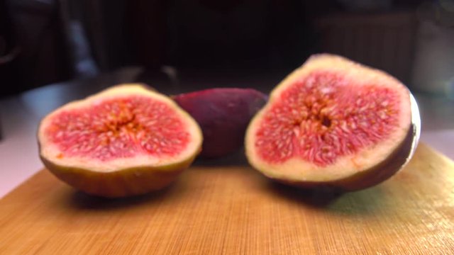 Girl picking the half of fig. 4K close up shot