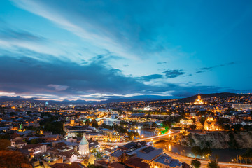 Fototapeta na wymiar Scenic Top View Of Tbilisi Georgia In Evening Illumination With 