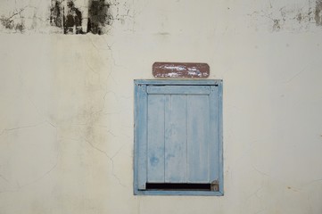 wood window on cement wall