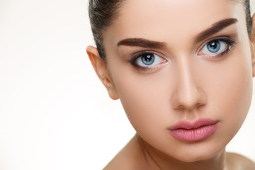 Closeup beauty face portrait of woman with clean skin