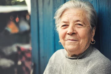 Happy old senior woman smiling outdoor © dundanim