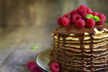 Ombre chocolate pancakes with fresh raspberry and chocolate sauc
