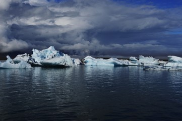 Ice lagoon under Vatnajökull glacier with stormy cloud on the sky