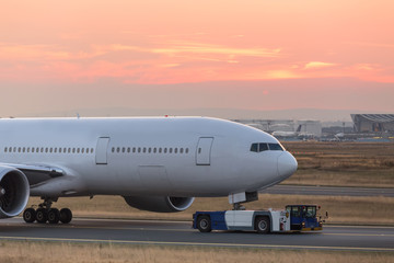 Fototapeta na wymiar airplane beeing towed on a runway