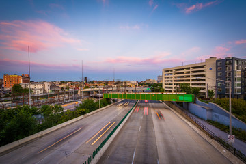 The Jones Falls Expressway at sunset, seen from the Howard Stree