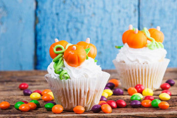Halloween cupcakes with colored decorations