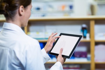 Pharmacist using digital tablet