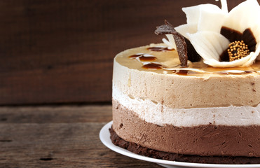 Chocolate cake on rustic wooden table, selective focus
