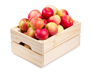 Wooden box full of fresh apples isolated