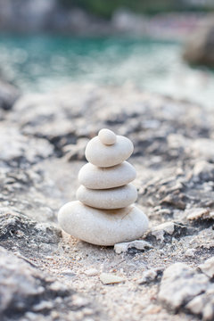 Balance stone on sea coast. Zen rocks on the beach