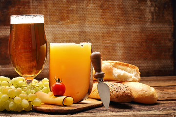 Yellow cheese appetizer and beer with space for text