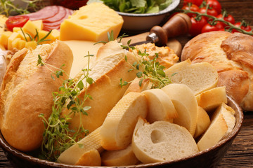 Fresh baguette and bread with herbs