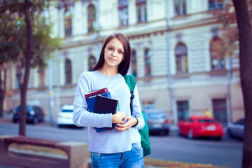 A shot of an ethnic college student studying on campus