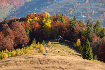 Autumn Landscape with a wooden house in the mountains