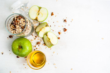 Selection of ingredients for cooking the traditional autumn apple crumble,  copy space, top view