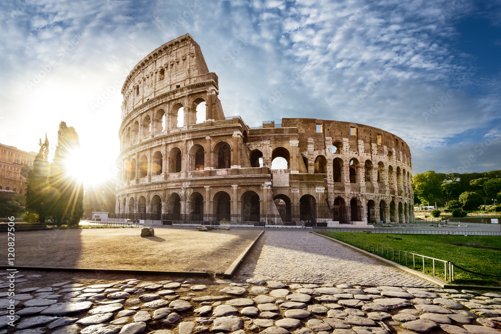 Wall mural Colosseum in Rome and morning sun, Italy